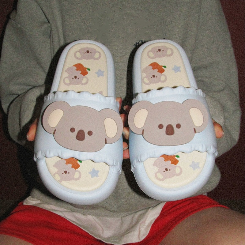 Cute sky blue koala print EVA slide sandals with 3D koala face, ruffled trim, and star print footbed, all-EVA indoor slip-on shoes