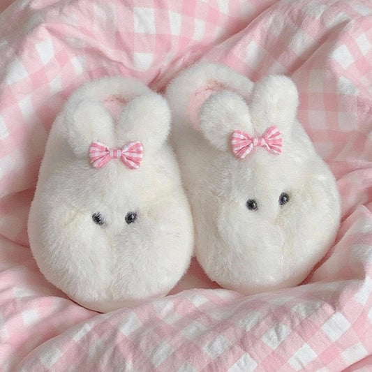Cute white bunny plush slippers with bow on ear and black dot eyes, closed-back fuzzy indoor shoes with EVA sole