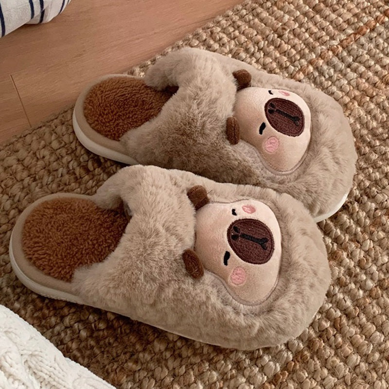 Fluffy khaki plush slippers decorated with a capybara face motif and stitched dark brown nose, soft indoor slip-on footwear with PVC sole