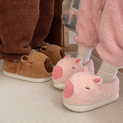 Cute pink capybara plush slippers with large rounded snout and small ears, closed-back fuzzy indoor shoes with EVA sole