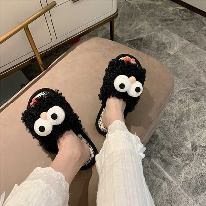 Black curly plush slippers featuring large white protruding eyes and a peach pom-pom, woven footbed indoor footwear with PVC sole