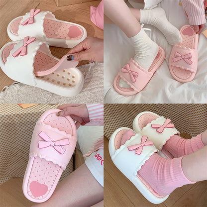 White EVA slip-on slippers featuring a 3D pink bow with scalloped trim and a pink polka dot footbed, lightweight indoor footwear