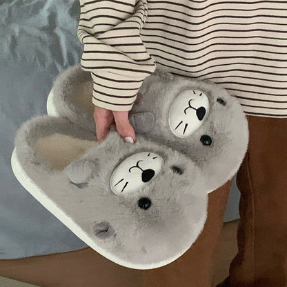 Adorable grey seal character plush slippers featuring a cream snout and whisker details, lightweight indoor footwear with EVA sole