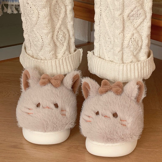 Khaki fuzzy cat character slippers with a decorative brown bow and minimalist face details, snug indoor home shoes with EVA sole