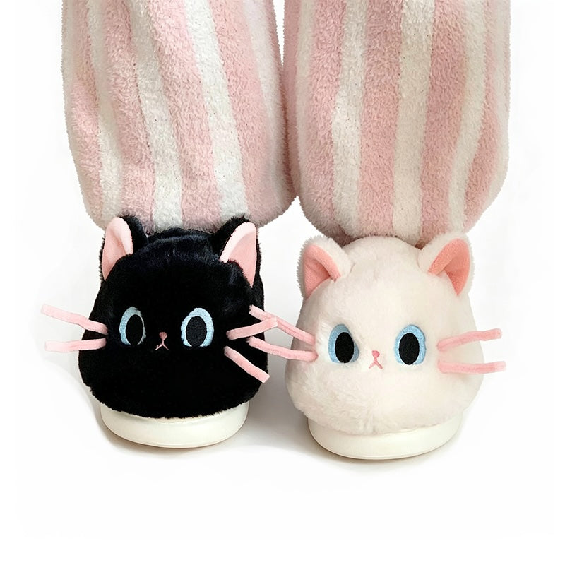 Cute black and white cat plush slippers with pink ears, blue eyes, and pink whiskers, closed-back fuzzy indoor shoes with EVA sole