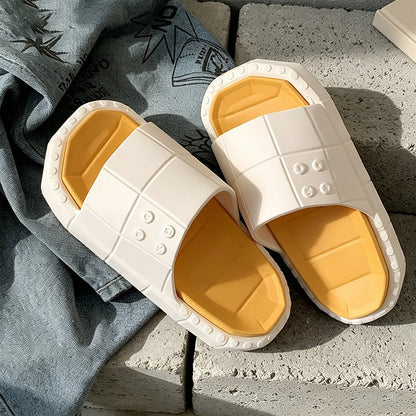 Cute white building block EVA slide sandals with blue footbed and red sole, lightweight color-block indoor shoes