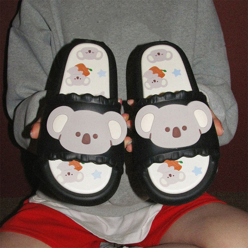 Cute black koala print EVA slide sandals with 3D koala face, ruffled trim, and star print footbed, all-EVA indoor slip-on shoes