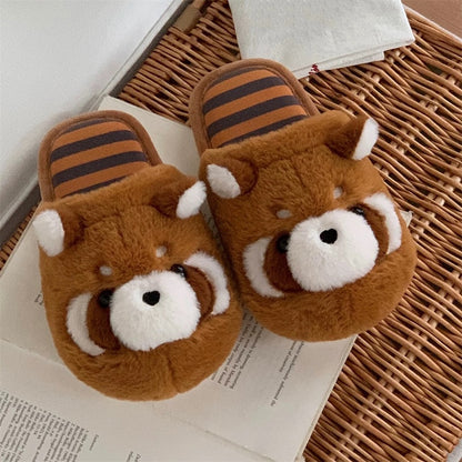 Cute brown raccoon face plush slippers with dark eye masks and white ear tips, warm indoor shoes with PVC sole