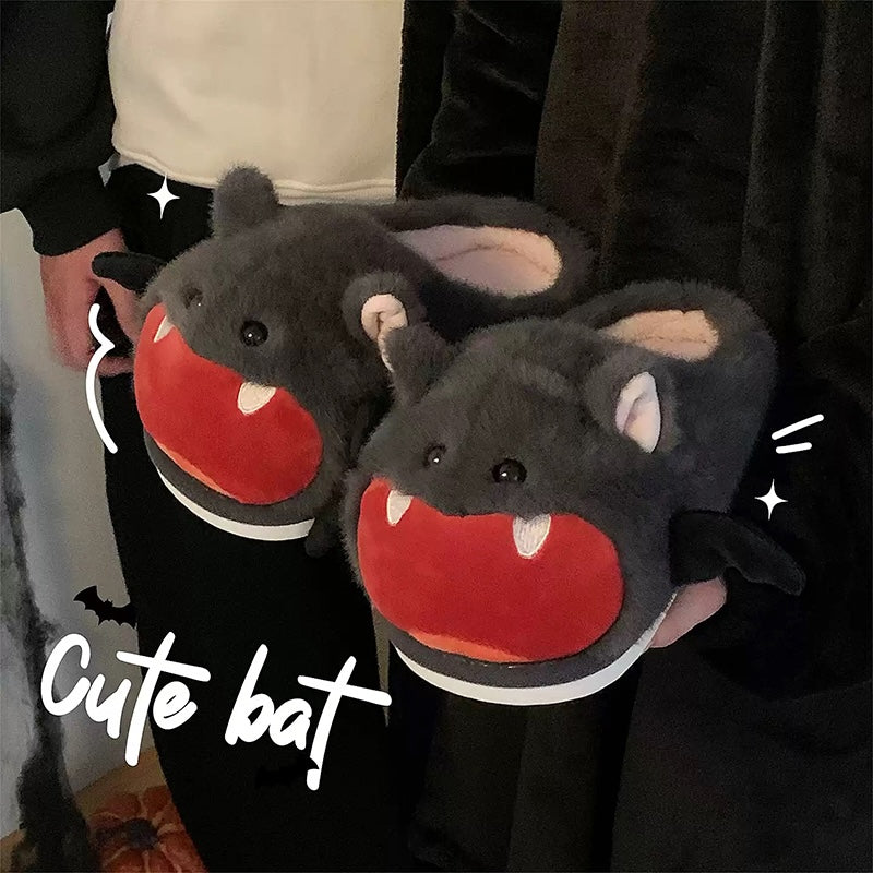 Cute gray Halloween bat plush slippers with red open mouth, white fangs, and bat wings, fuzzy indoor shoes with PVC sole