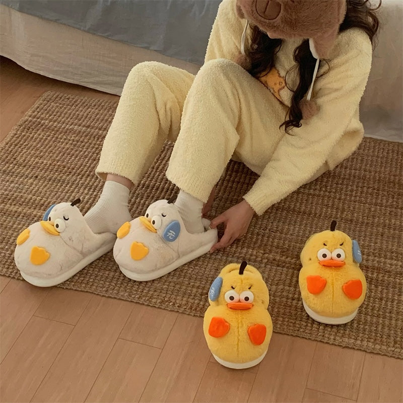 Cute yellow duck plush slippers with orange beak and asymmetrical cheek patches, indoor shoes with EVA sole