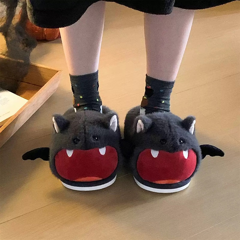 Cute gray Halloween bat plush slippers with red open mouth, white fangs, and bat wings, fuzzy indoor shoes with PVC sole