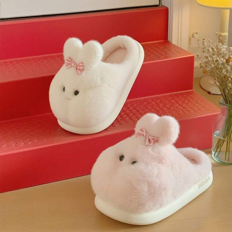 Cute white bunny plush slippers with bow on ear and black dot eyes, closed-back fuzzy indoor shoes with EVA sole