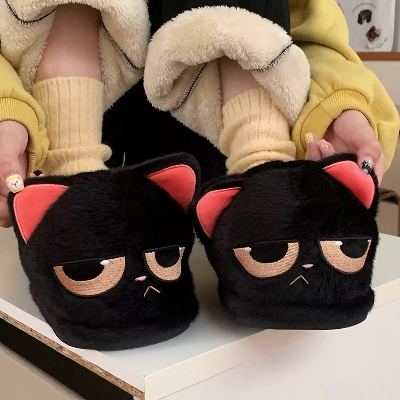 Cute black cat plush slippers with half-closed eyes and pink inner ears, fuzzy indoor shoes