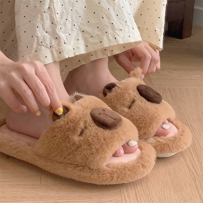 Cute brown capybara plush slide slippers with closed eyes, big dark nose, and fluffy faux fur, indoor shoes with PVC sole