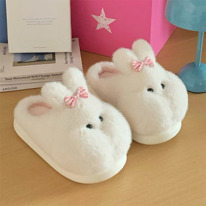 Cute white bunny plush slippers with bow on ear and black dot eyes, closed-back fuzzy indoor shoes with EVA sole