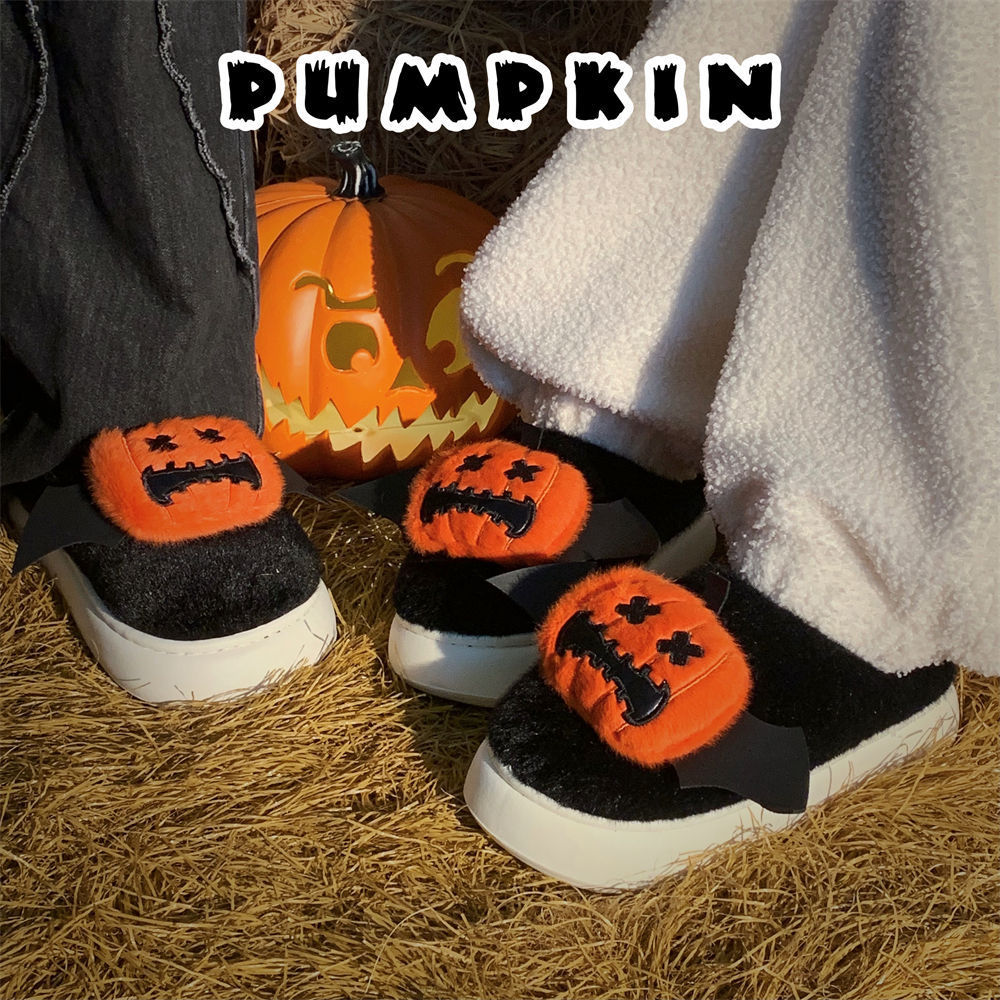 Cute black Halloween pumpkin plush slippers with bat wings and stitched face, fuzzy indoor shoes with EVA sole