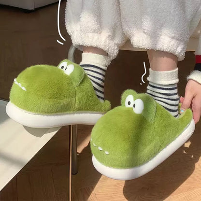 Cute green crocodile plush slippers with big white googly eyes and flat teeth, fuzzy indoor shoes with EVA sole