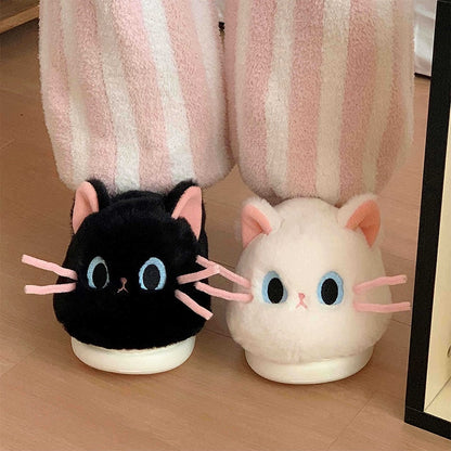 Cute black and white cat plush slippers with pink ears, blue eyes, and pink whiskers, closed-back fuzzy indoor shoes with EVA sole