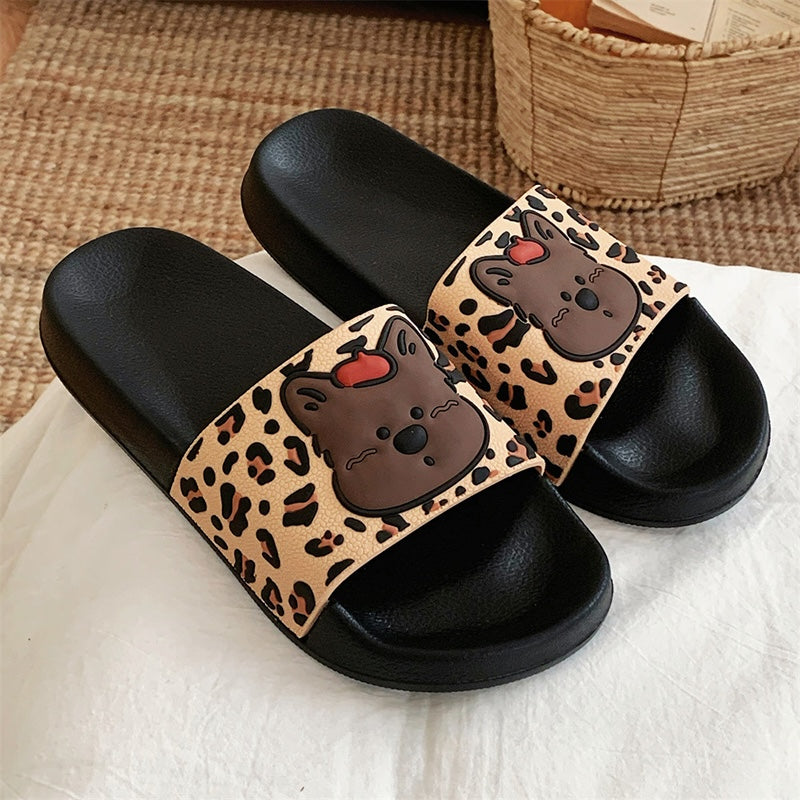 Cute black leopard print dog slippers with brown dog face and red tongue, PVC upper and EVA sole, slip-on indoor shoes