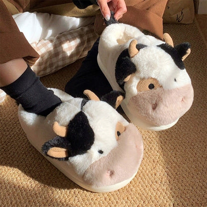 Cute black and white cow plush slippers with brown nose and horns, closed-back fuzzy indoor shoes with EVA sole