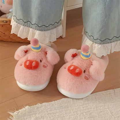 Cute pink birthday pig plush slippers with striped party hat, pom-pom, and red cherry accent, indoor shoes with EVA sole