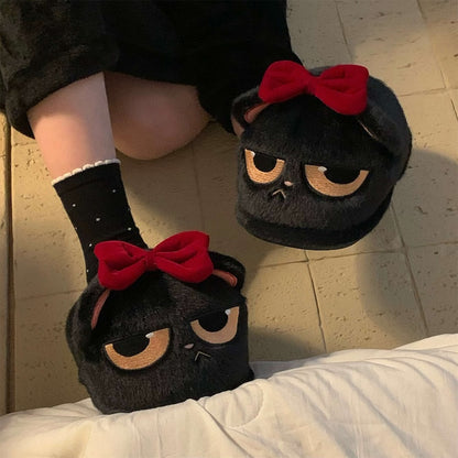 Cute black closed-back cat plush slippers with removable red bow and sleepy eyes, fuzzy indoor shoes with PVC sole