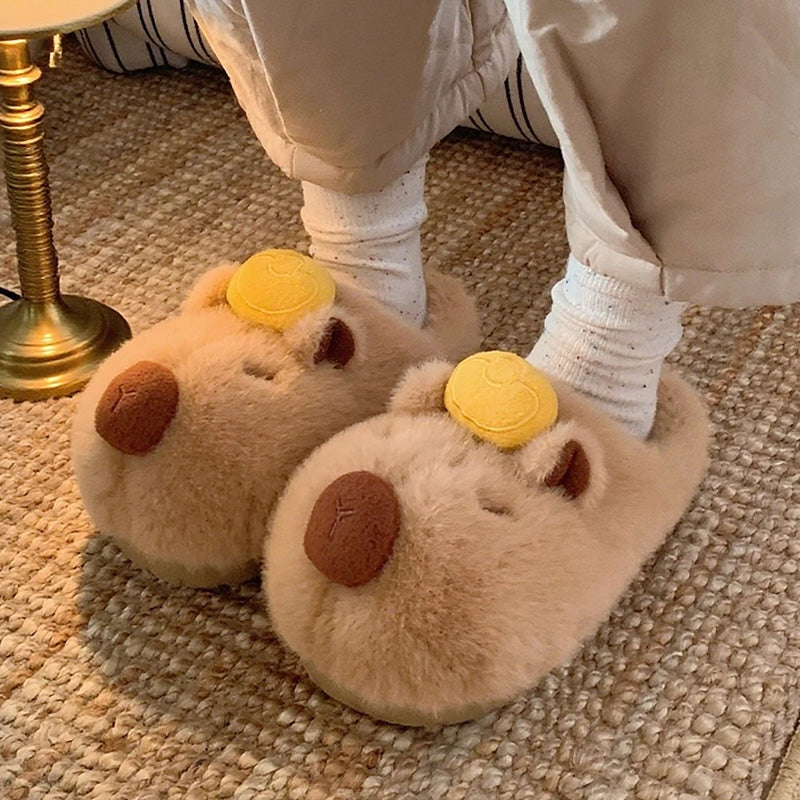 Cute brown capybara plush slippers with gold ingot on head and closed eyes, fuzzy indoor shoes with TPR sole