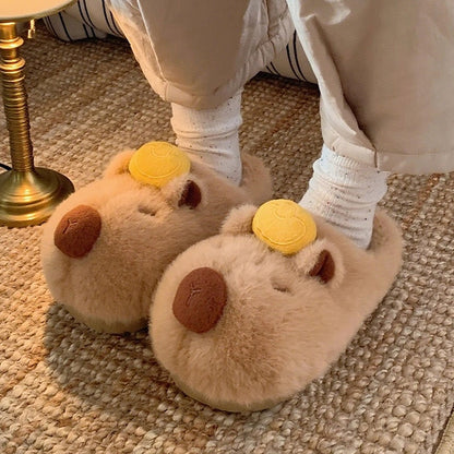 Cute brown capybara plush slippers with gold ingot on head and closed eyes, fuzzy indoor shoes with TPR sole
