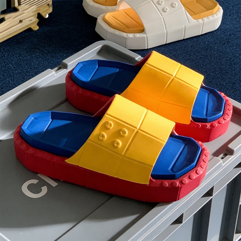 Cute yellow building block EVA slide sandals with blue footbed and red sole, lightweight color-block indoor shoes