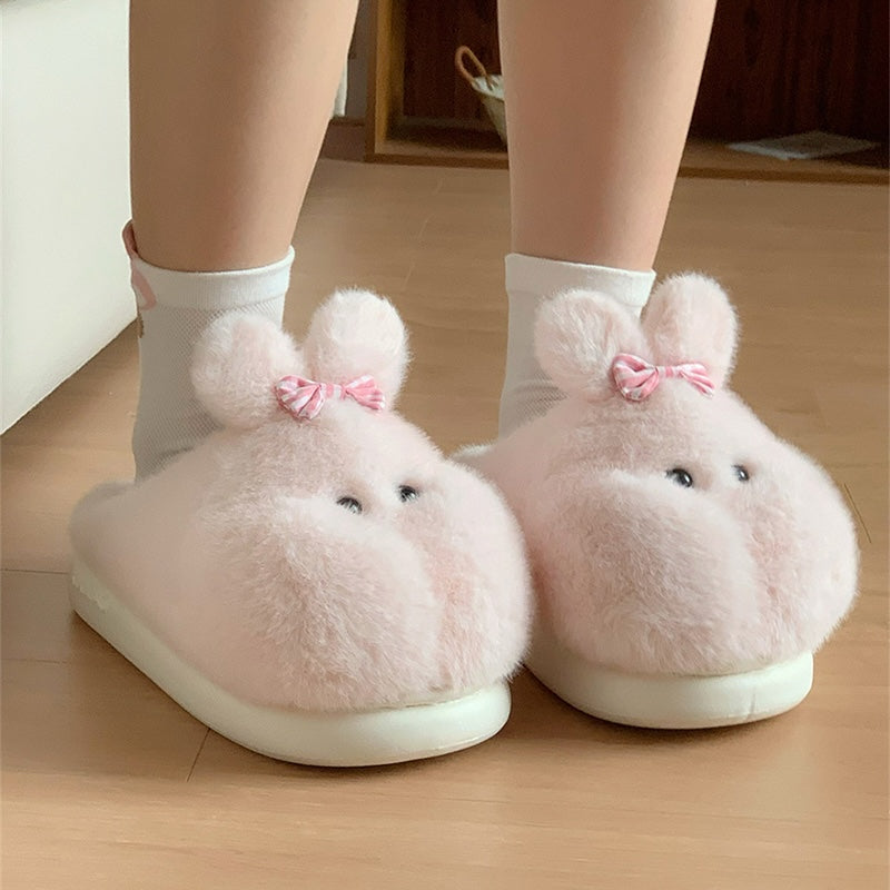 Cute pink bunny plush slippers with bow on ear and black dot eyes, closed-back fuzzy indoor shoes with EVA sole