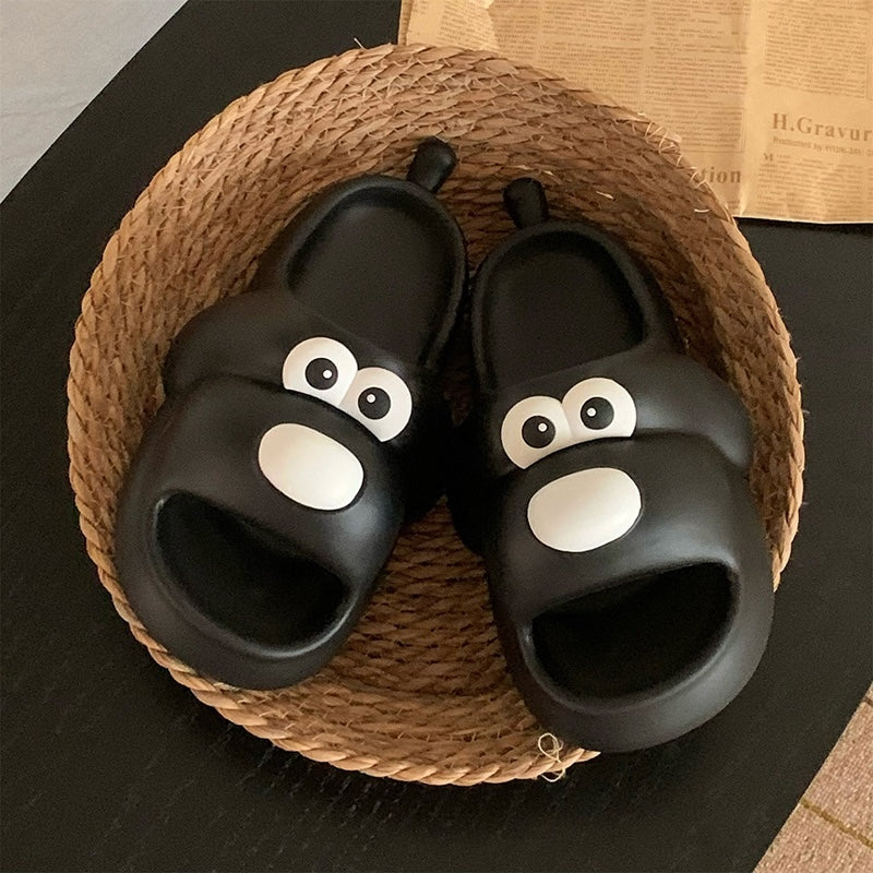 Cute black cartoon dog EVA slide sandals with big white eyes and small tail, lightweight all-EVA indoor shoes