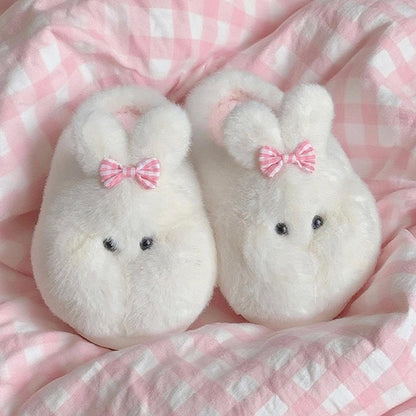 Cute white bunny plush slippers with bow on ear and black dot eyes, closed-back fuzzy indoor shoes with EVA sole