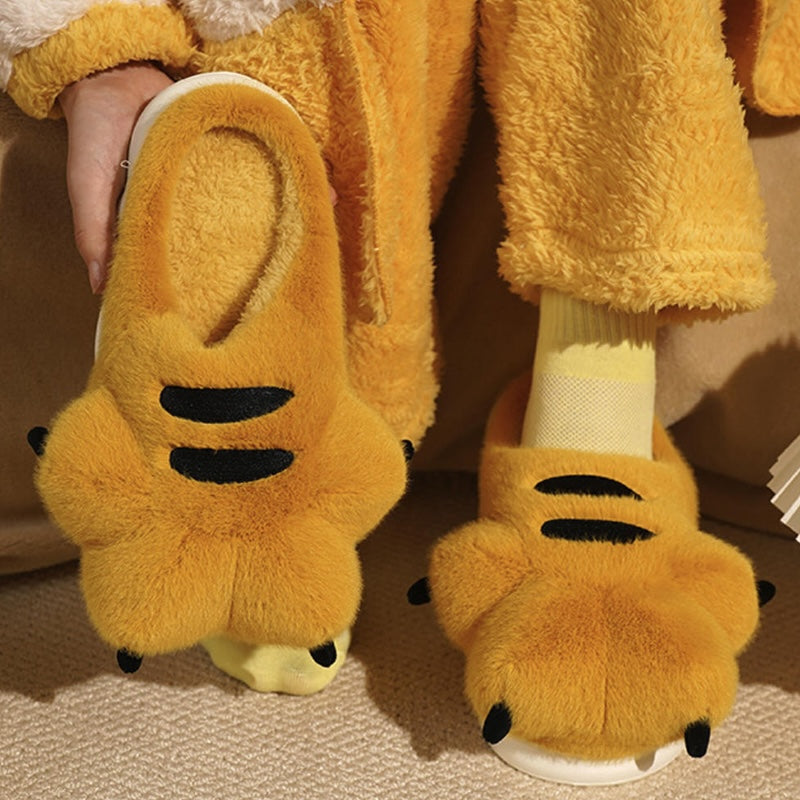 Cute yellow tiger paw plush slippers with black stripes and claws, fuzzy animal paw indoor shoes with EVA sole