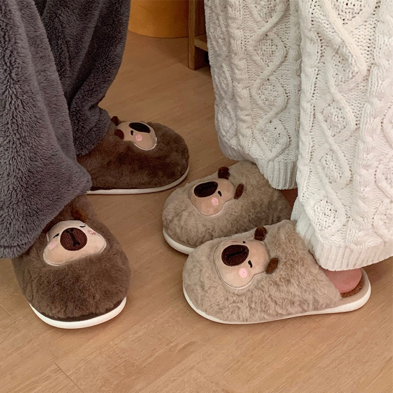 Brown fuzzy slippers featuring an embroidered capybara character with pink cheek accents, comfortable home shoes with PVC outsole