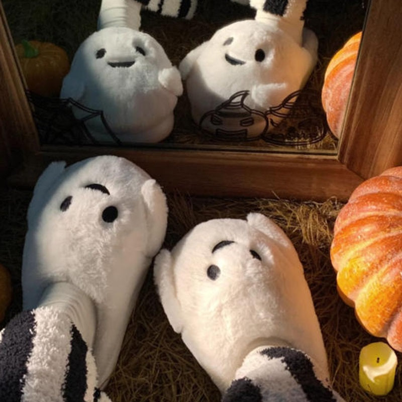 Playful white Halloween ghost face plush slippers featuring black dot eyes and a wavy smile, soft indoor footwear with EVA sole