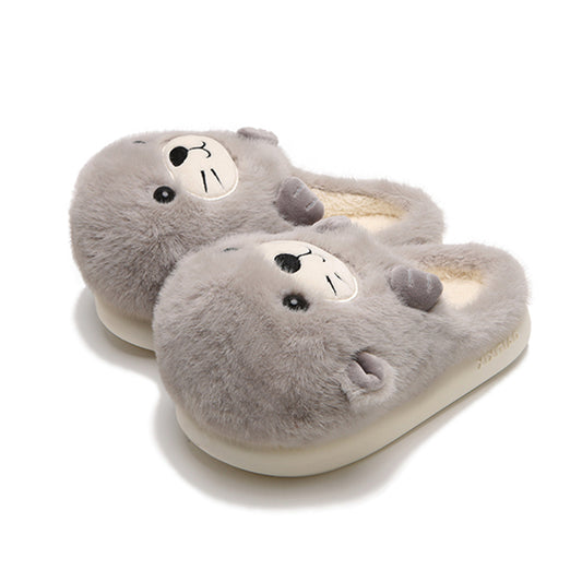 Adorable grey seal character plush slippers featuring a cream snout and whisker details, lightweight indoor footwear with EVA sole
