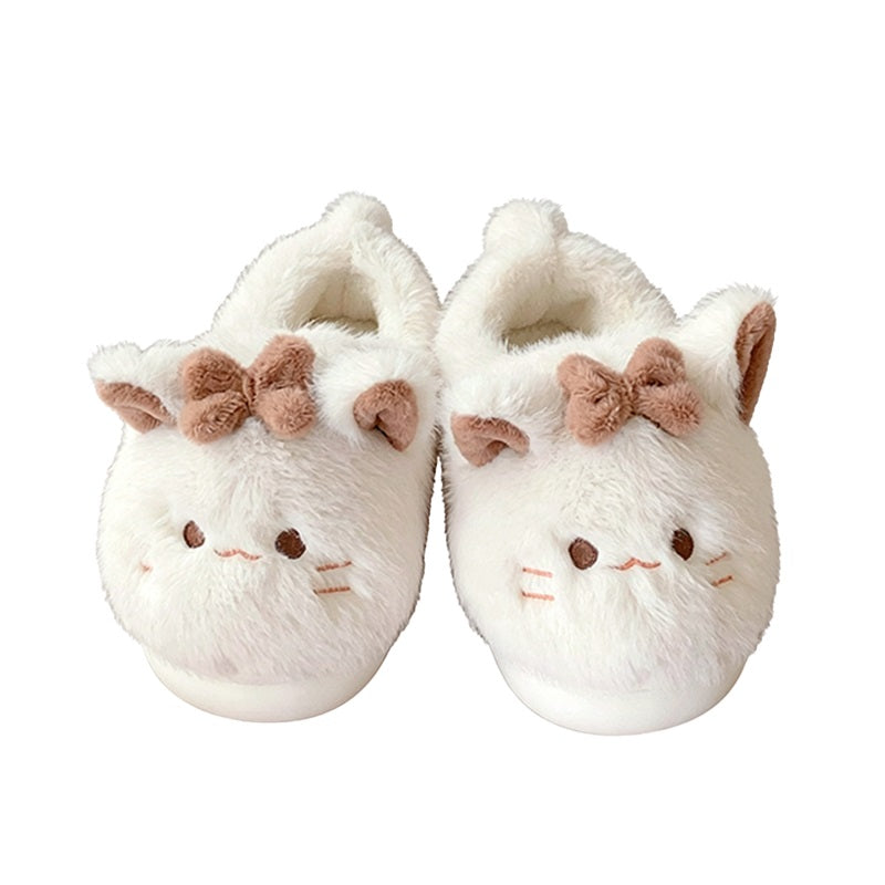 Beige closed-back plush slippers featuring a bow cat design with line eyes and a tiny tail, warm indoor footwear with EVA sole