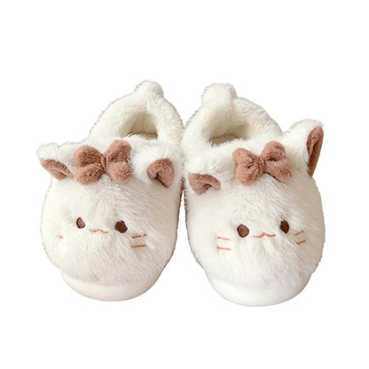 Beige closed-back plush slippers featuring a bow cat design with line eyes and a tiny tail, warm indoor footwear with EVA sole