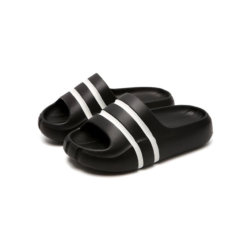 Black wide-strap EVA slide sandals with white double stripes, all-EVA low-arch indoor shoes