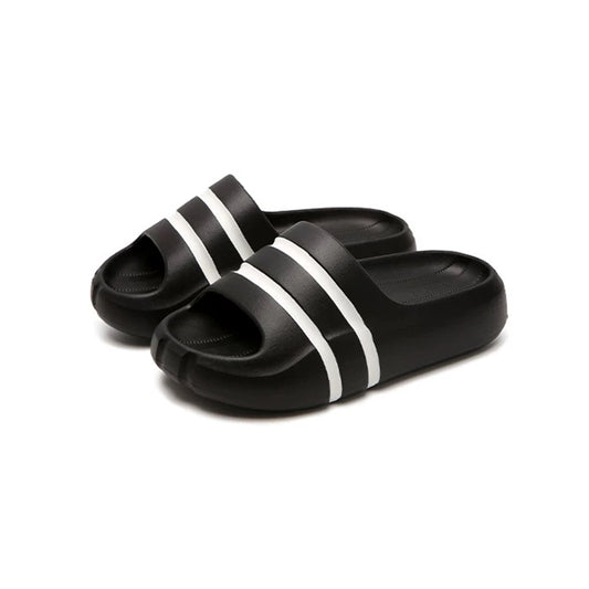 Black wide-strap EVA slide sandals with white double stripes, all-EVA low-arch indoor shoes