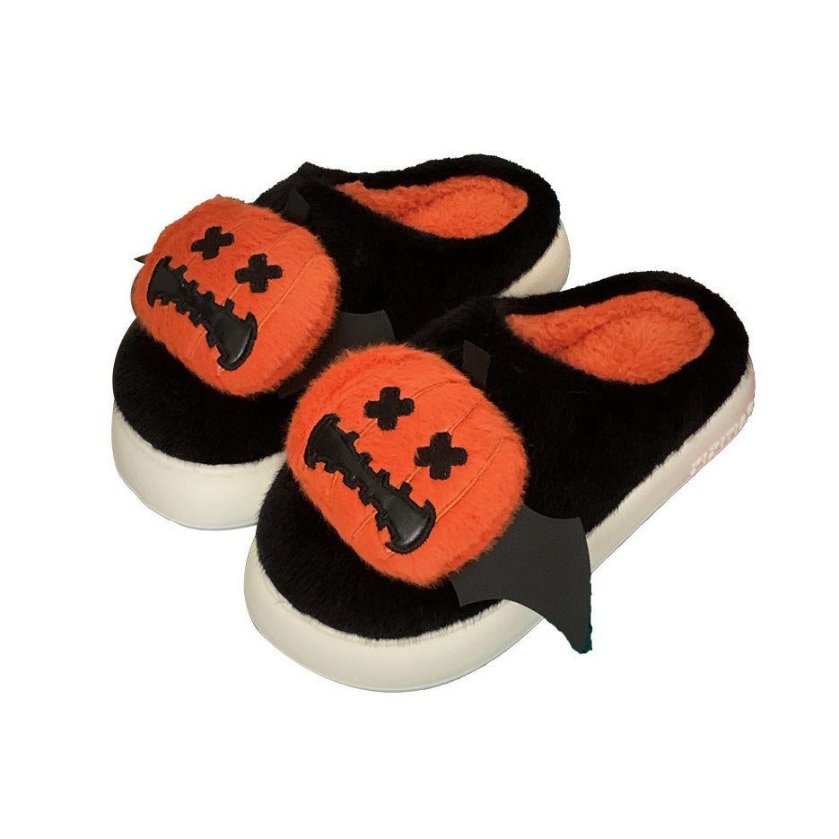 Cute black Halloween pumpkin plush slippers with bat wings and stitched face, fuzzy indoor shoes with EVA sole