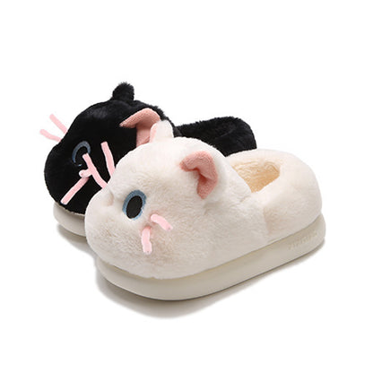 Cute black and white cat plush slippers with pink ears, blue eyes, and pink whiskers, closed-back fuzzy indoor shoes with EVA sole