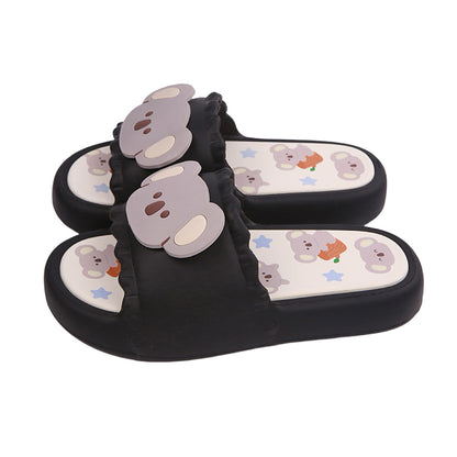 Cute black koala print EVA slide sandals with 3D koala face, ruffled trim, and star print footbed, all-EVA indoor slip-on shoes