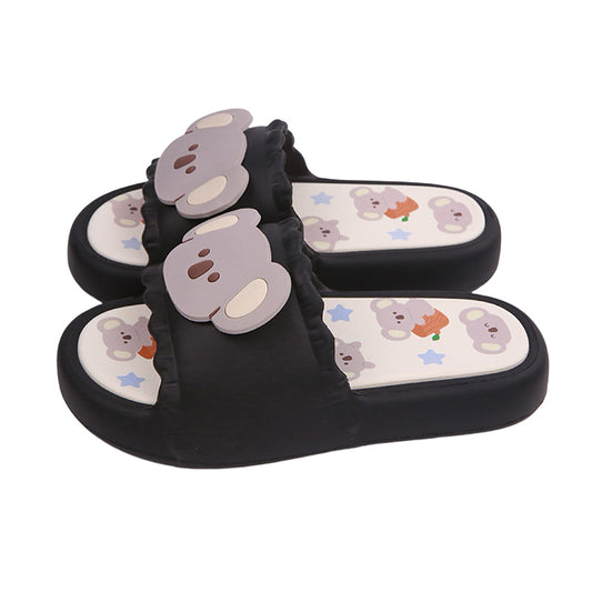 Cute black koala print EVA slide sandals with 3D koala face, ruffled trim, and star print footbed, all-EVA indoor slip-on shoes