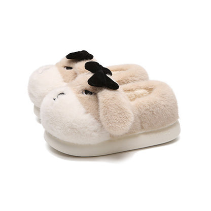 Cute khaki dog plush slippers with floppy ears, closed eyes, and removable black bow, closed-back fuzzy indoor shoes with EVA sole