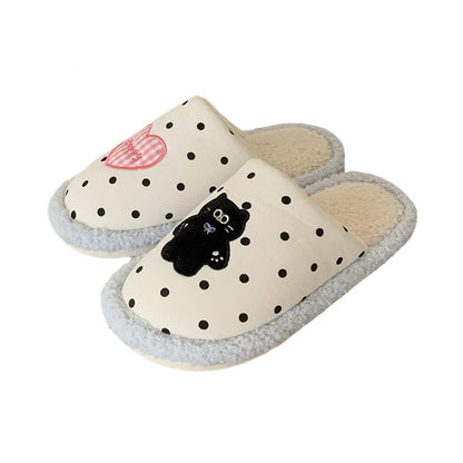 Cute light blue polka dot indoor slippers with pink heart and black cat patch, fuzzy lined fabric shoes with PVC sole