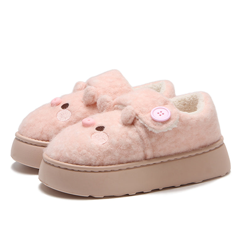 Cute pink pig plush slippers with button accent, pig face with snout and round ears, closed-back fuzzy indoor shoes with EVA sole