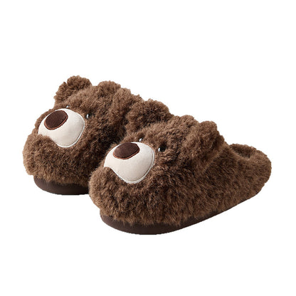 Dark brown shaggy bear plush slippers with a large white muzzle patch and a central fabric nose, cozy indoor footwear with TPR sole