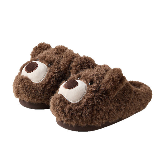 Dark brown shaggy bear plush slippers with a large white muzzle patch and a central fabric nose, cozy indoor footwear with TPR sole