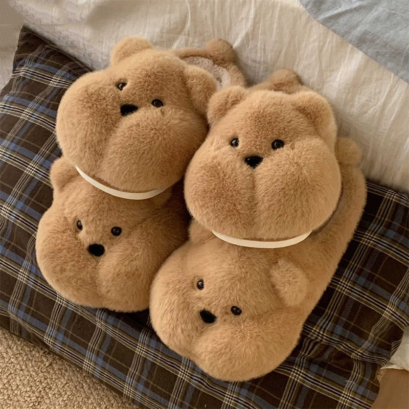 Brown round bear character plush slippers designed with glossy black eyes and a tiny nose, lightweight home footwear with PVC sole